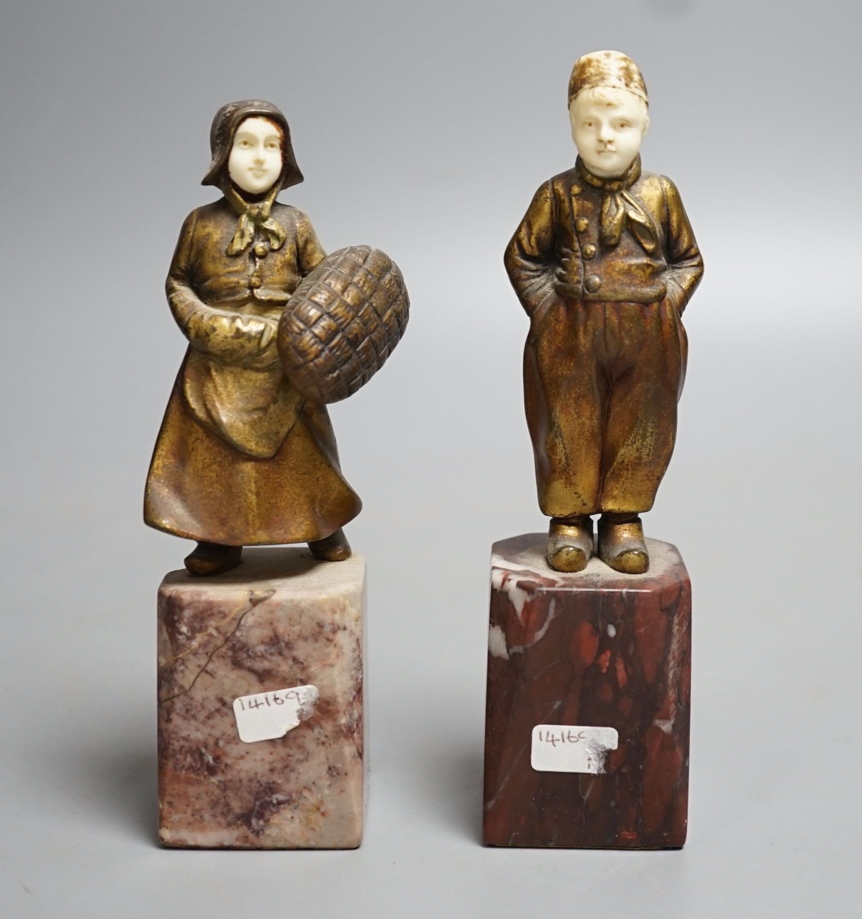 Two Art Deco gilt bronze and ivory Dutch youths, on marble plinths (one a.f) 15cm